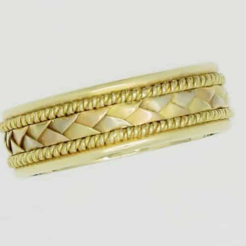 Gold braided ring with intricate design