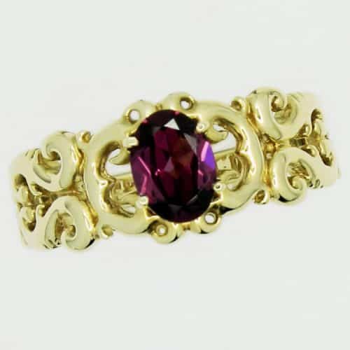 Gold ring with purple gemstone
