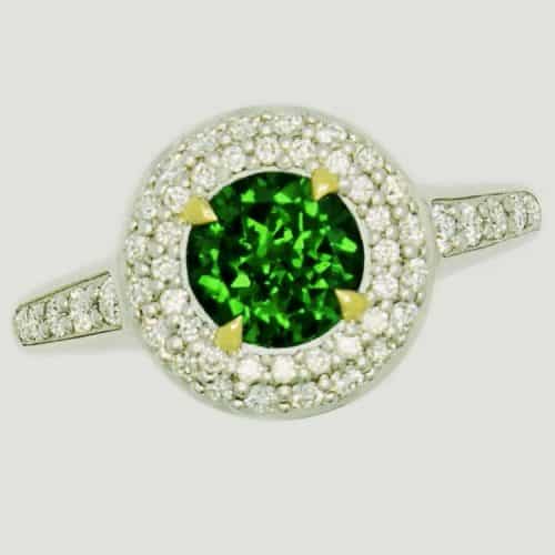 Green gemstone ring with diamonds