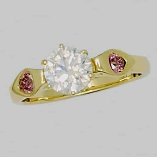 Gold ring with diamond and pink stones
